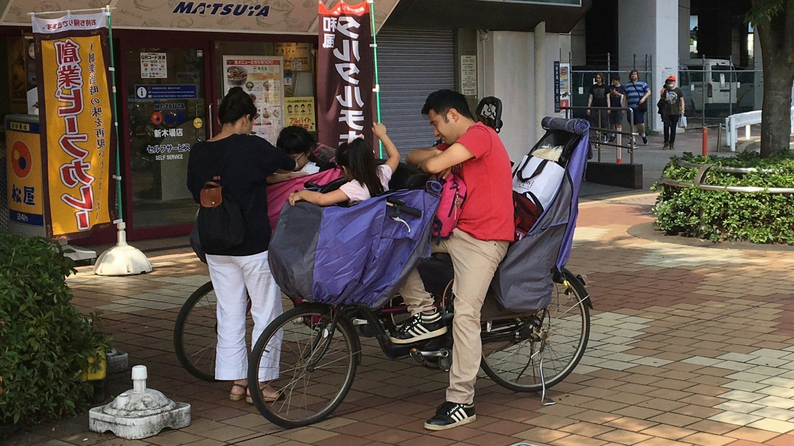 The ‘Made in Japan’ Mamacheri e-bike brand with rain-protected front child seat/shopping basket and rear child seat is popular among urban families. - Photo Jo Beckendorff