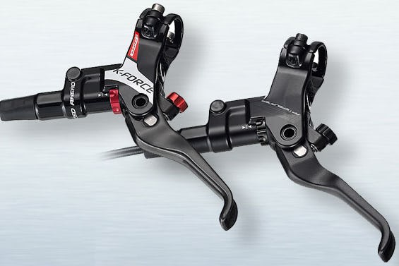 FSA’s new brakes feature very light magnesium castings, carbon composite levers, and titanium hardware. 