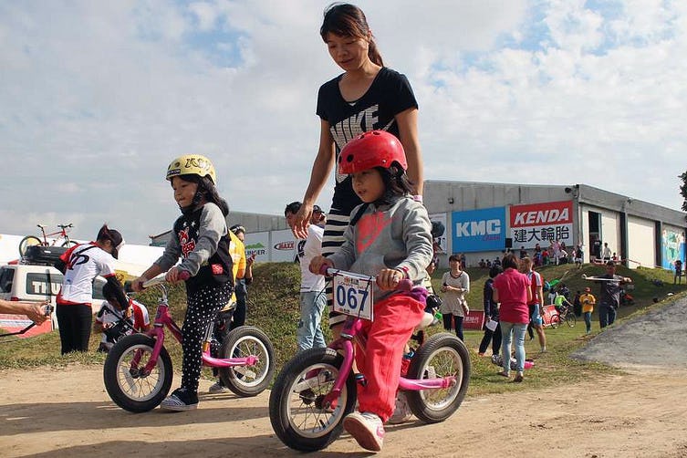 Many of the young competitors practiced and experienced the fun of riding a push bike up the slopes. – Photo Lohas