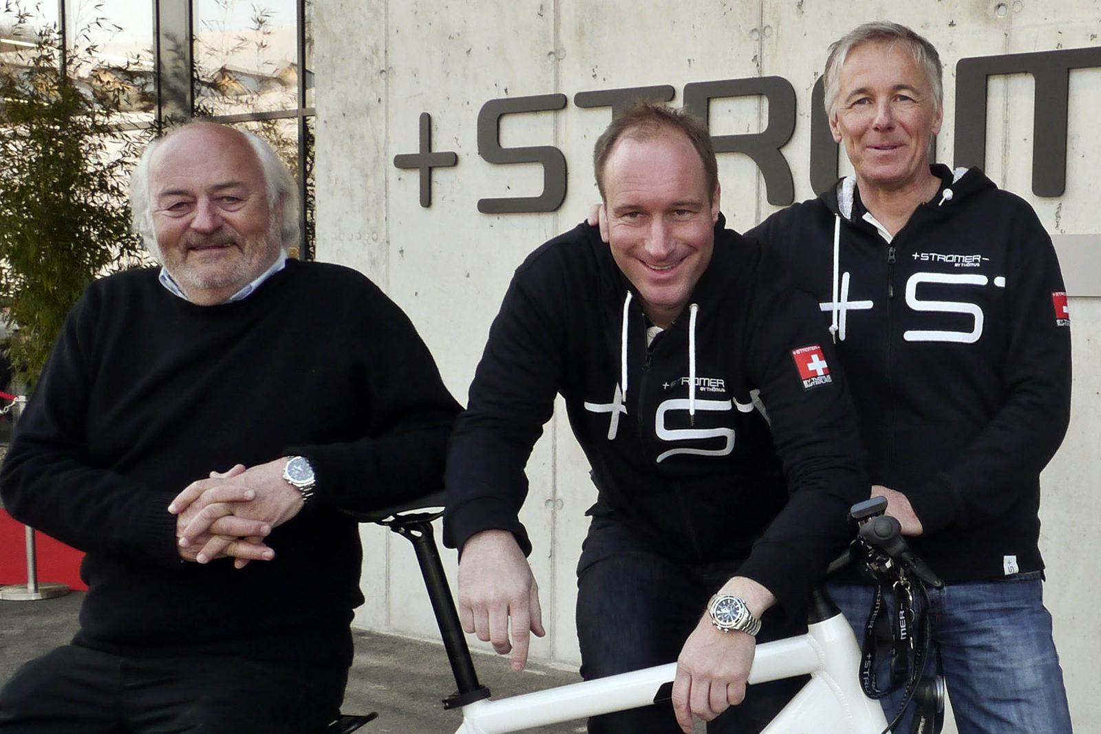 Two years ago, when everything still looked bright at the opening of the new Stromer HQ; CEO Christian Müller (right) with Chairman of the Board Thömu Binggeli (middle) and ‘Patron’ Andy Rihs (left). – Photo Peter Hummel