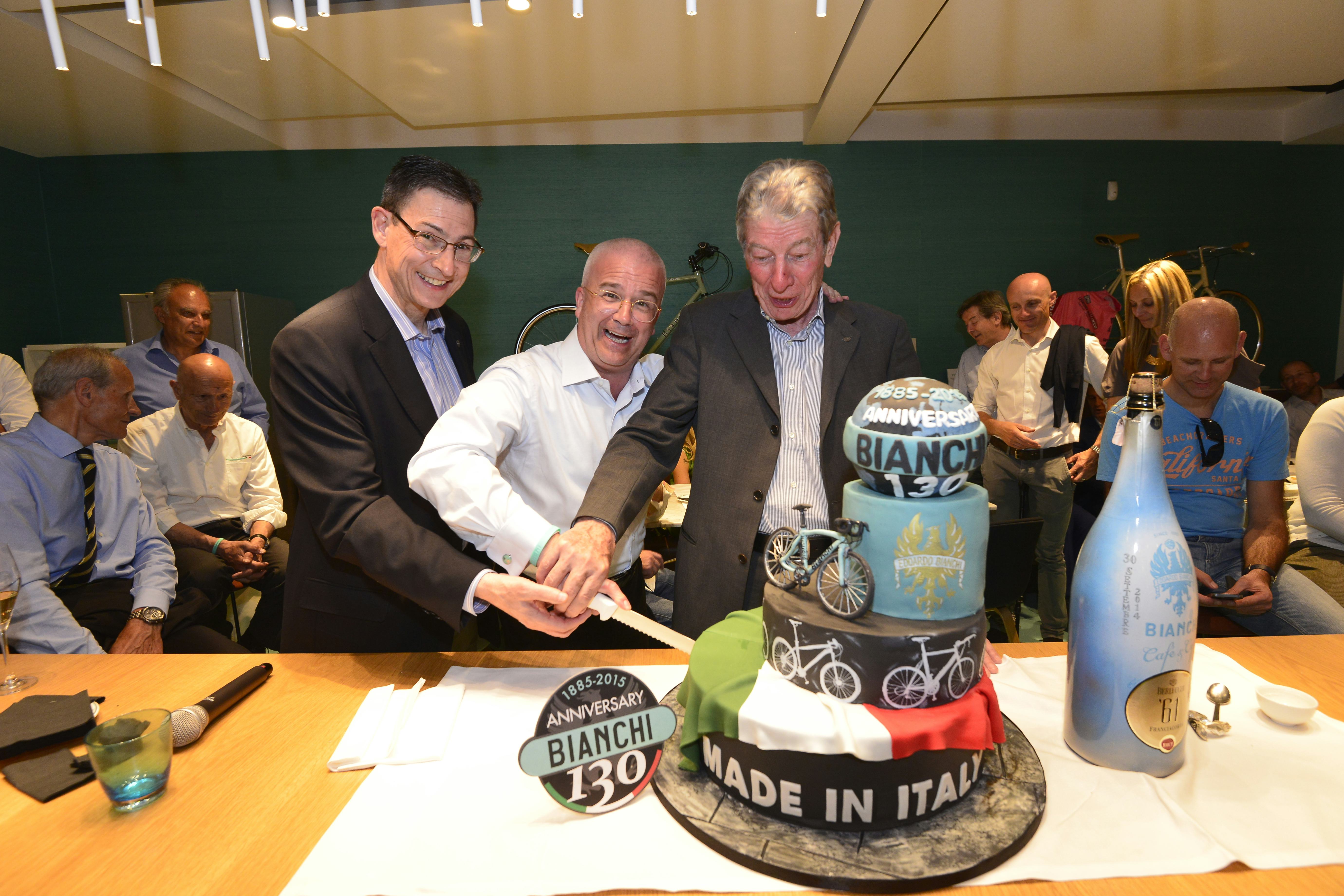 Digging into the birthday cake (from left) Bianchi CEO Bob Ippolito, Cycleurope CEO Tony Grimaldi and Felice Gimondi. – Photo Dario Belingheri/Bettini 