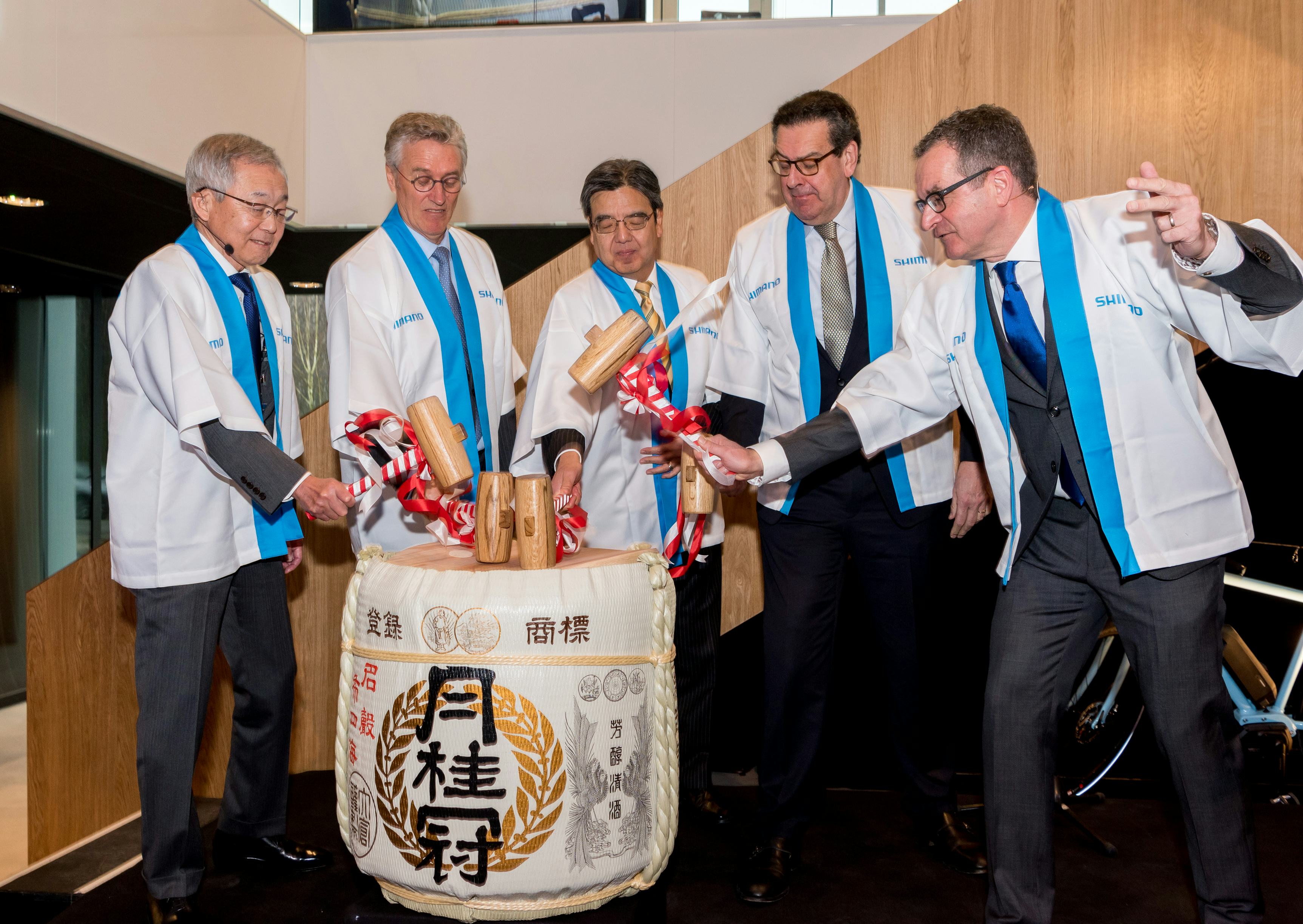 Breaking of sake barrel marked official opening of Shimano Europe HQ with (left) Shimano Inc. President Yozo Shimano and right Shimano EU President Marc Van Rooij. – Photo Shimano