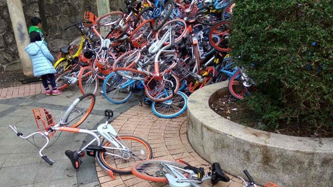 In cities like Shenzhen public bikes are being dumped on huge piles. China’s bike-share craziness is expected to stop by year-end. - Photo AFP