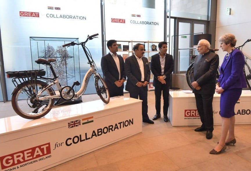 Indian and British Prime Ministers Narendra Modi and Theresa May were shown Hero’s Lectro bike range by MD Pankaj Munjal (2nd from left). - Photo Hero