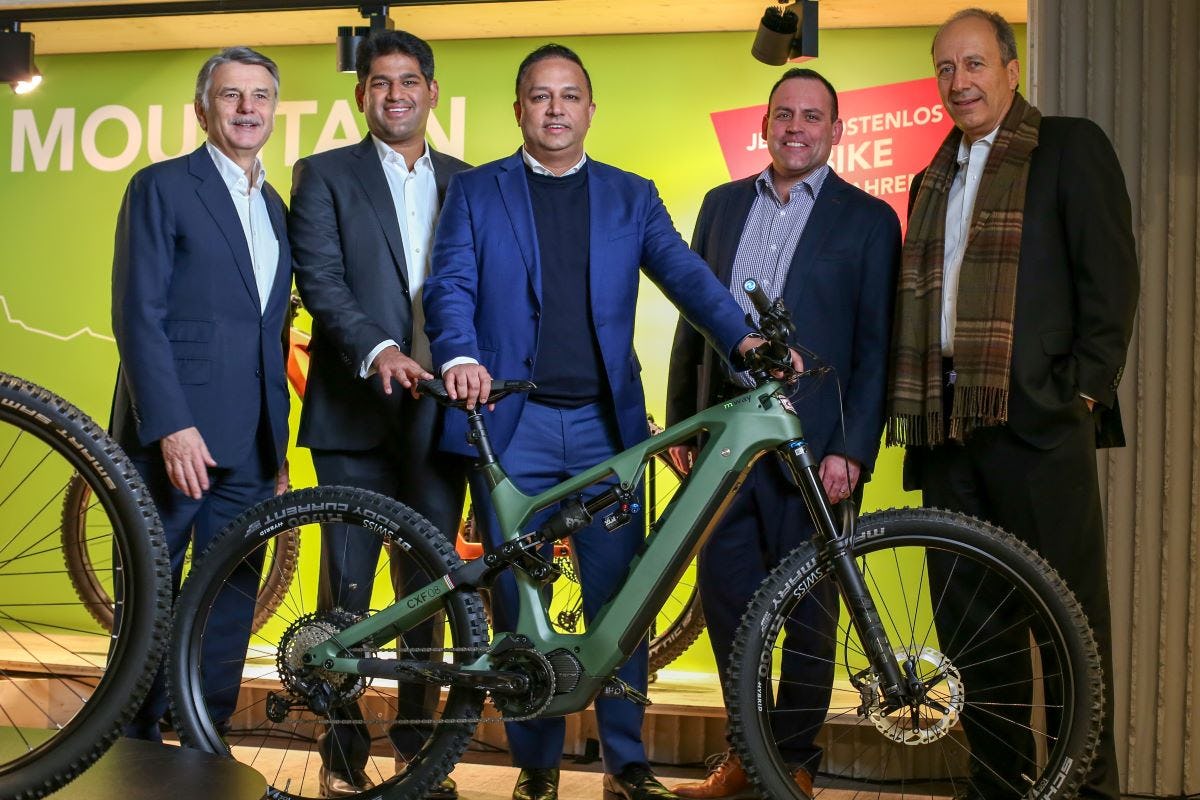From left: Sir Ralf Speth, Sudarshan Venu and Sharad Mohan Mishra (all TVS Motor) after signing the contract with SEMG CEO Reto Waeffler and Rainer Fröhlich of Constellation Capital. - Photo SEMG